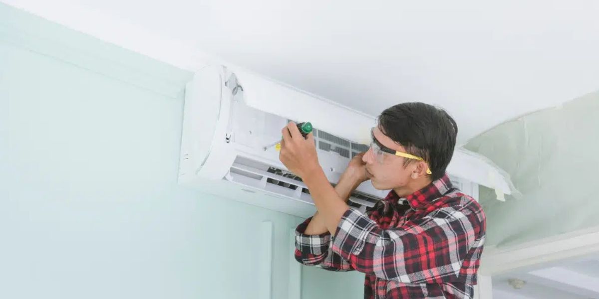 HVAC technicians installing a new central air conditioning system in a residential home | How Long Does AC Installation Take?