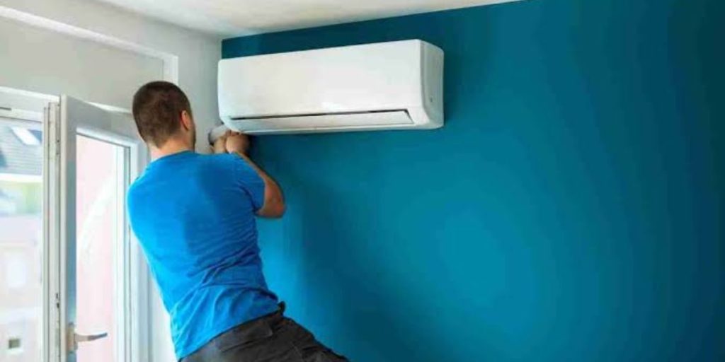 HVAC technician preparing a home for new air conditioning installation by checking the installation area, electrical system, ductwork, and equipment requirements | AC Installation Preparation