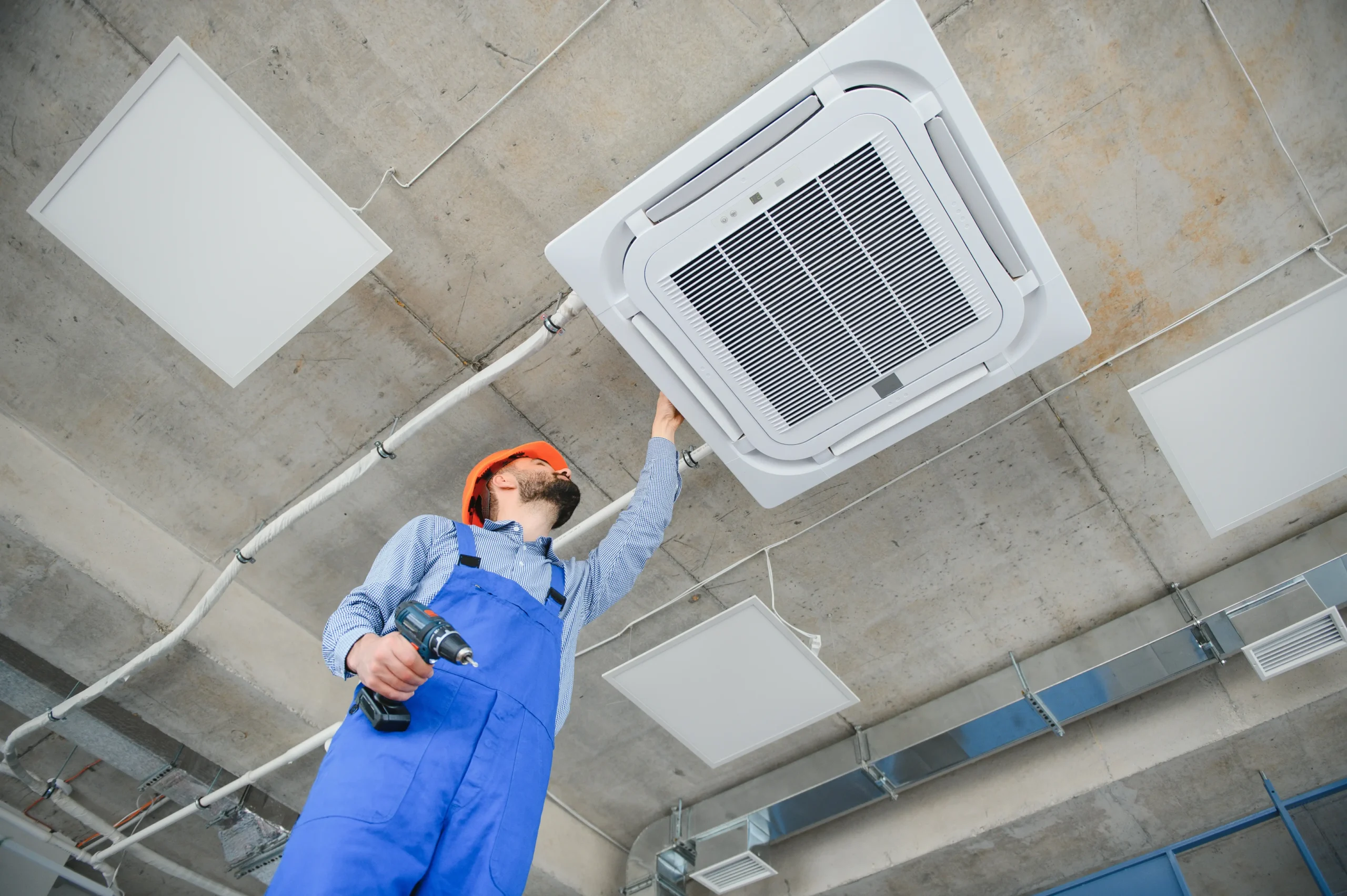 Air-conditioning being installed by the service worker.