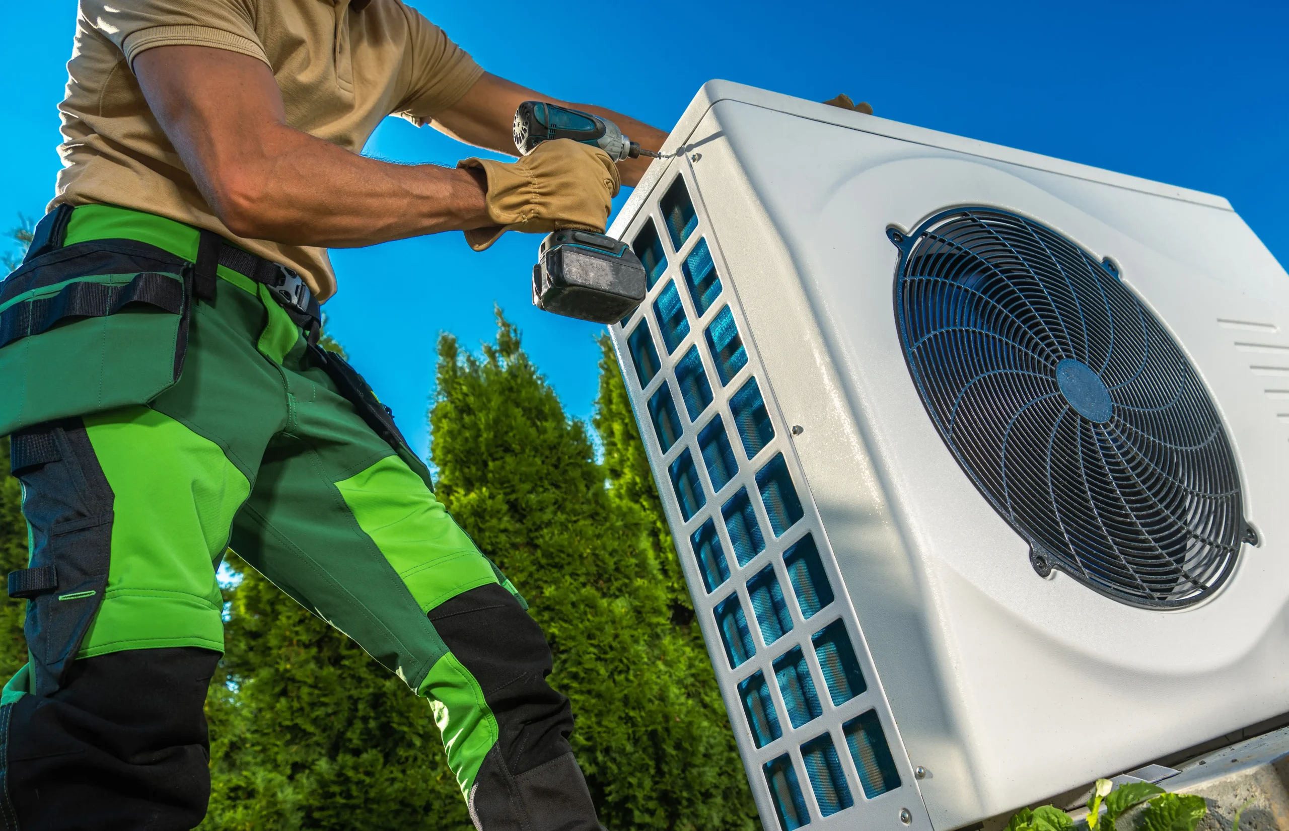 Air-conditioning service worker installing the HVAC.