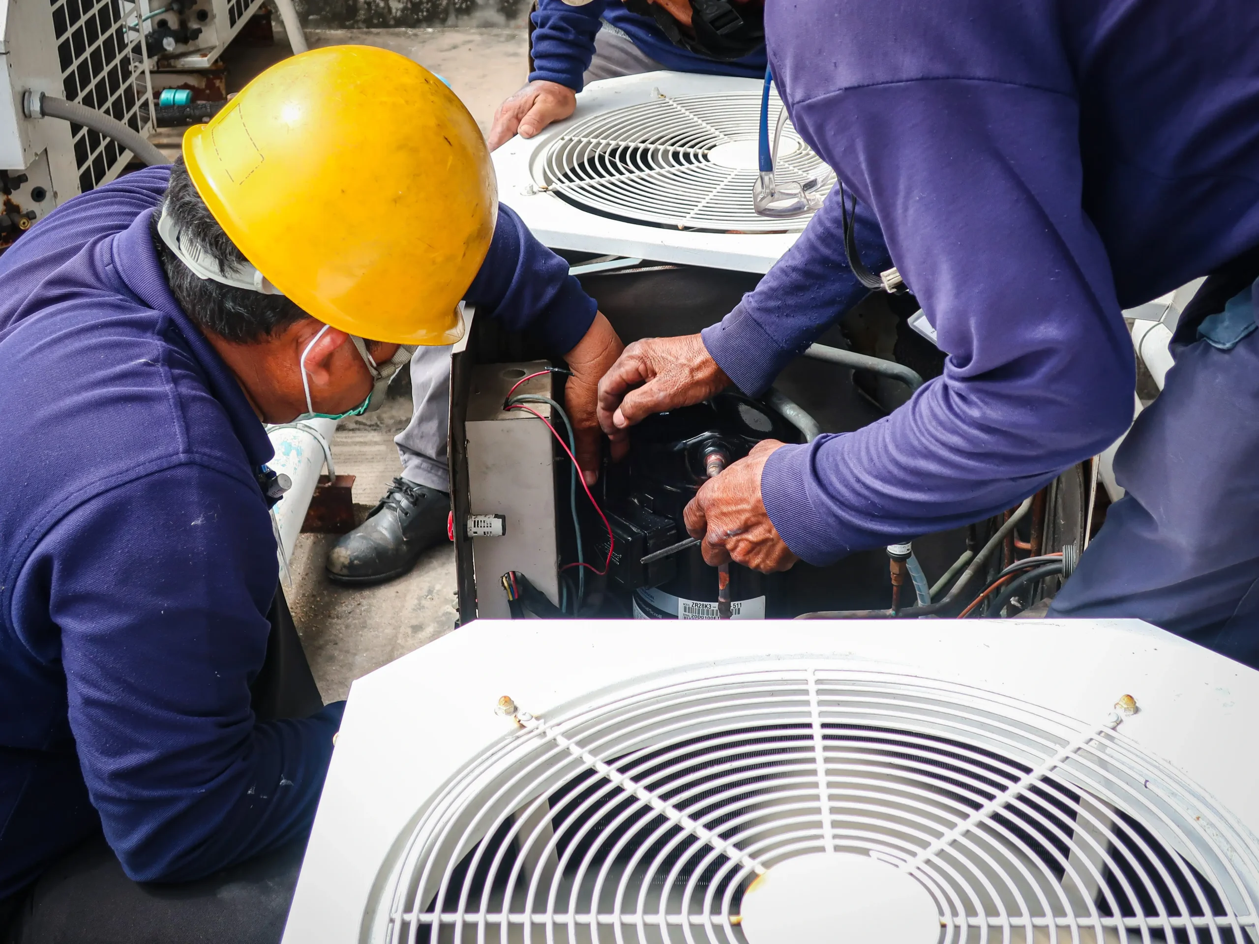 Workers repairing the HVAC problem.